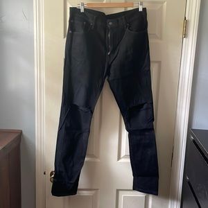 Levis Black ripped at knees. Slim taper jeans